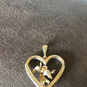 Jewelry - 14 carat gold heart with angel in middle. Jewelry - 14 carat gold heart with angel in middle.